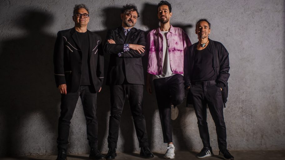 Cafe-Tacvba-in-front-of-gray-wall-all-band-members
